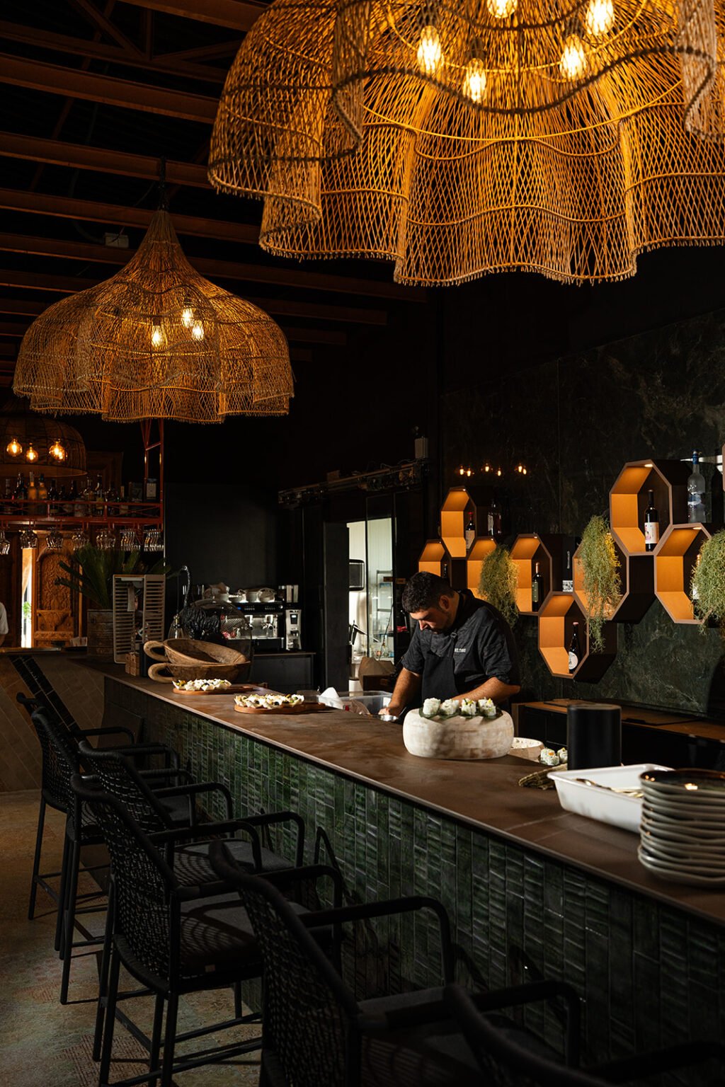 The bar of Bella Tapas in Rojales with rattan lamps and warm evening light