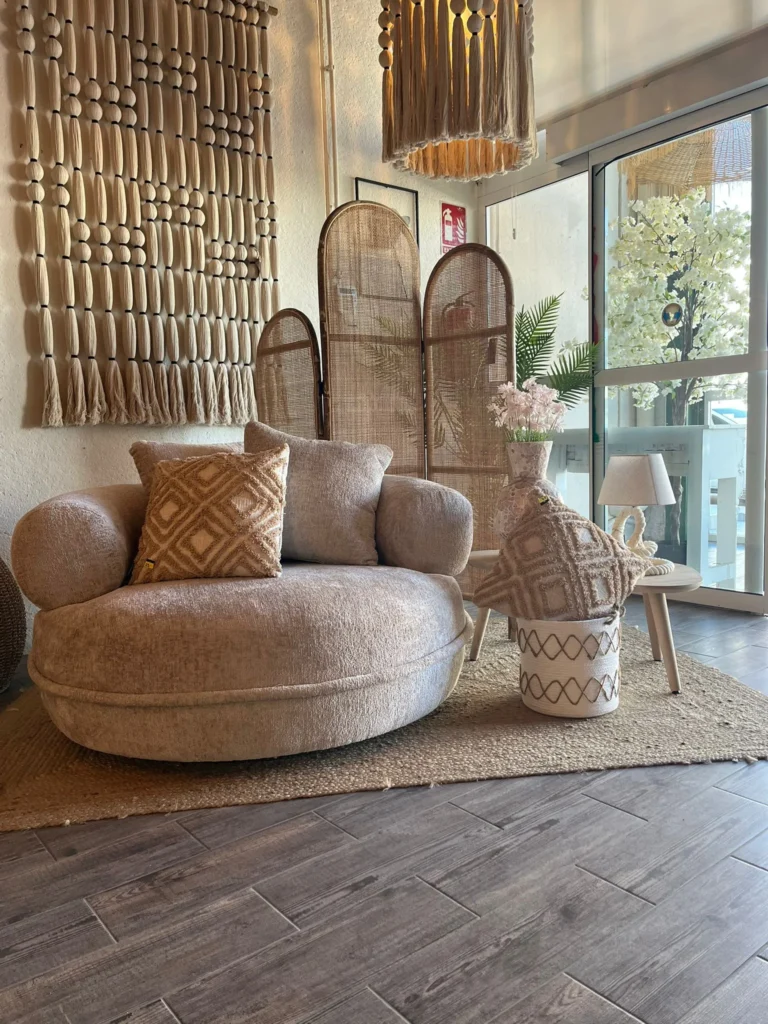 Round boucle armchair with rattan screens